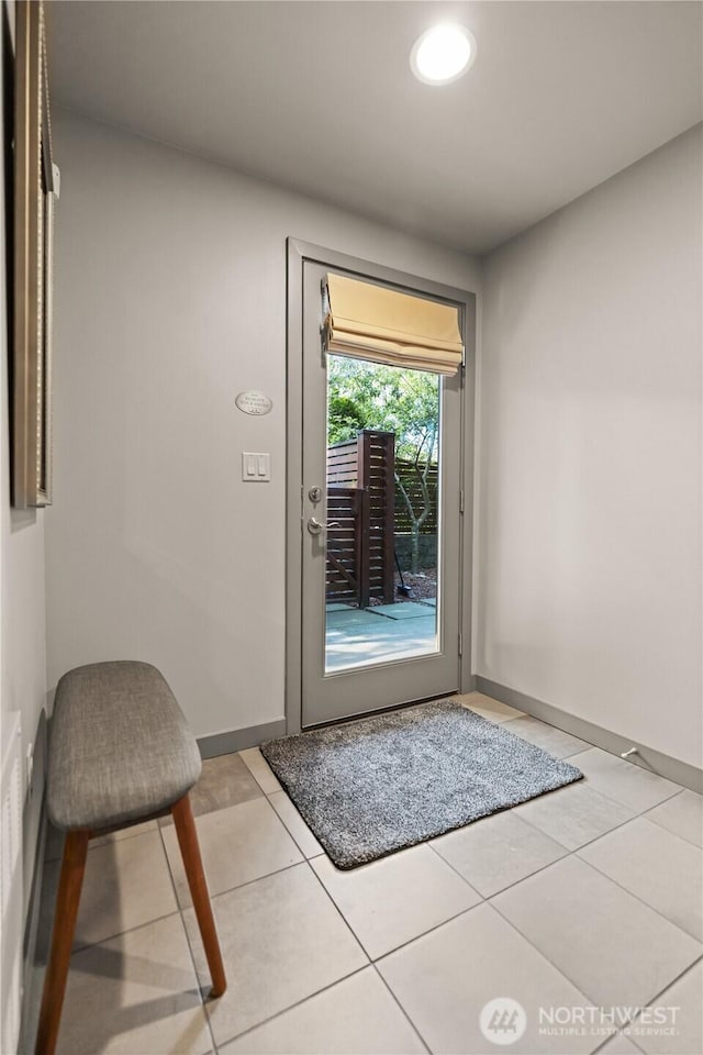 923 N 85th St Unit A, Seattle, WA 98103 - doorway to outside with light tile patterned floors and baseboards