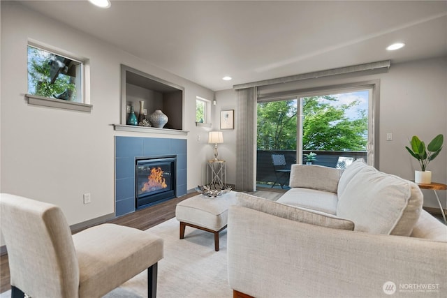 923 N 85th St Unit A, Seattle, WA 98103 - living area featuring recessed lighting, wood finished floors, and a tiled fireplace