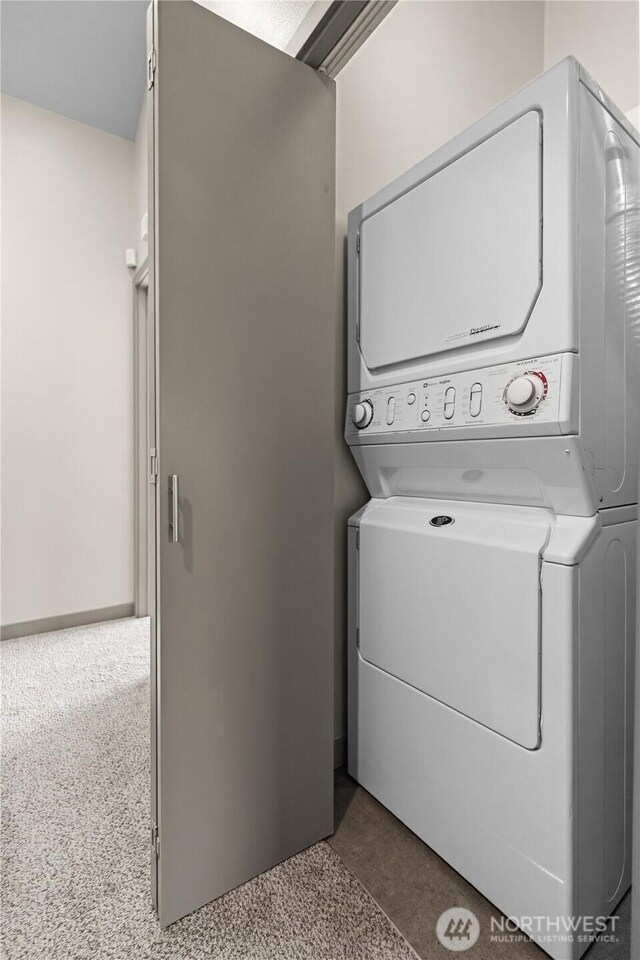 923 N 85th St Unit A, Seattle, WA 98103 - laundry area with estacked washer and dryer and carpet floors