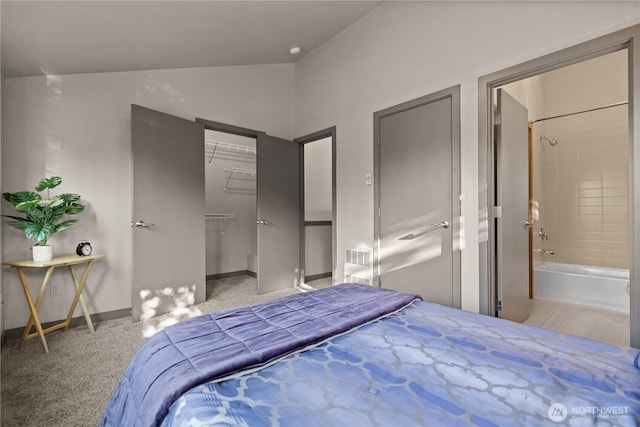923 N 85th St Unit A, Seattle, WA 98103 - bedroom with lofted ceiling, a walk in closet, carpet floors, ensuite bathroom, and a closet