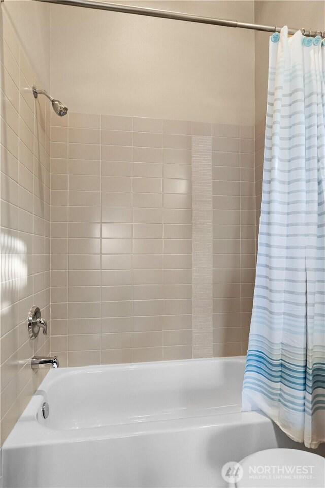 923 N 85th St Unit A, Seattle, WA 98103 - full bath featuring shower / bath combination with curtain and toilet
