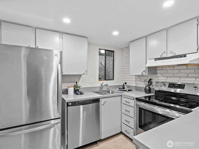 4920 200th St SW Unit A201, Lynnwood, WA 98036 - kitchen featuring stainless steel appliances, white cabinets, light countertops, recessed lighting, and under cabinet range hood