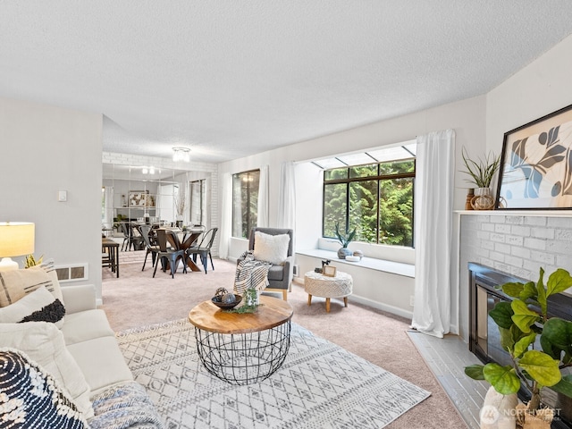 4920 200th St SW Unit A201, Lynnwood, WA 98036 - carpeted living area with a textured ceiling and a fireplace