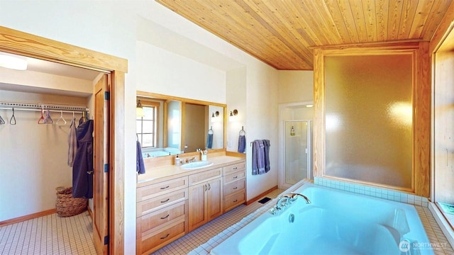 156 Poechmann Rd, Okanogan, WA 98840 - full bath with vanity, wood ceiling, a garden tub, tile patterned floors, and a walk in closet
