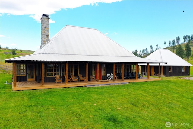 156 Poechmann Rd, Okanogan, WA 98840 - back of house featuring a lawn, a chimney, and a wooden deck