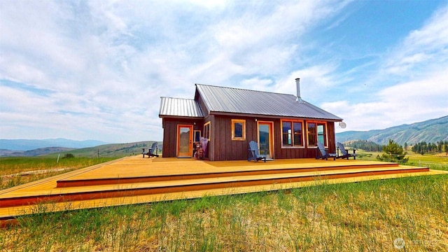 156 Poechmann Rd, Okanogan, WA 98840 - rear view of property with a deck with mountain view and a metal roof
