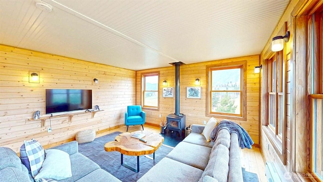 156 Poechmann Rd, Okanogan, WA 98840 - living area with a wood stove, hardwood / wood-style flooring, plenty of natural light, and wood walls
