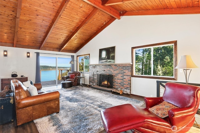 10806 W Morris Blvd, Steilacoom, WA 98388 - living room featuring a wood ceiling with exposed beams, wood finished floors, a fireplace, healthy amount of natural light, and a water view