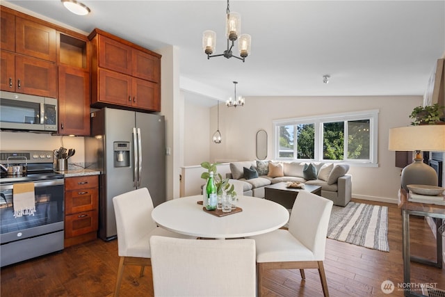 12712 NE 157th St, Woodinville, WA 98072 - dining area featuring a chandelier, lofted ceiling, and dark wood-type flooring