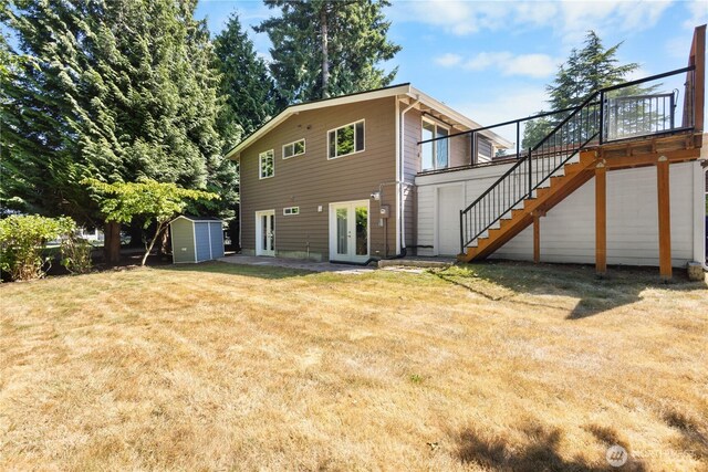 12712 NE 157th St, Woodinville, WA 98072 - back of property with french doors, stairway, a storage unit, and a yard