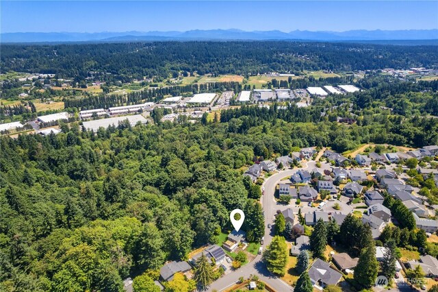 12712 NE 157th St, Woodinville, WA 98072 - aerial overview of property's location featuring a mountainous background and nearby suburban area
