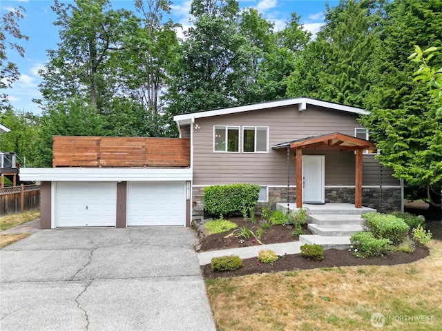 12712 NE 157th St, Woodinville, WA 98072 - view of front facade with driveway, stone siding, a garage, and a balcony