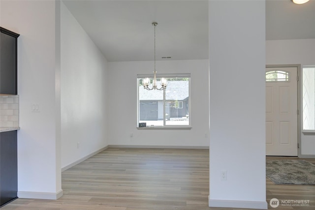 232 Jett Ct, Montesano, WA 98563 - unfurnished dining area with light wood finished floors and a chandelier