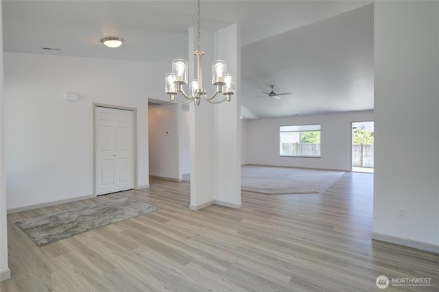 232 Jett Ct, Montesano, WA 98563 - unfurnished dining area with a chandelier, a ceiling fan, wood finished floors, and high vaulted ceiling