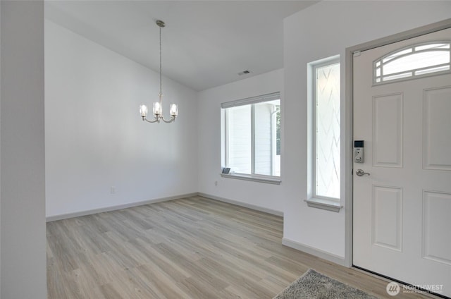 232 Jett Ct, Montesano, WA 98563 - entrance foyer featuring vaulted ceiling, light wood-style floors, and a chandelier
