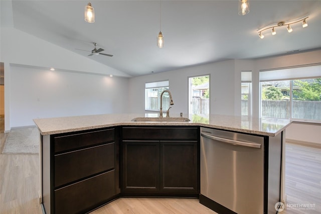 232 Jett Ct, Montesano, WA 98563 - kitchen with stainless steel dishwasher, vaulted ceiling, plenty of natural light, light wood finished floors, and a ceiling fan