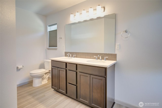 232 Jett Ct, Montesano, WA 98563 - full bath with wood finished floors, double vanity, and backsplash