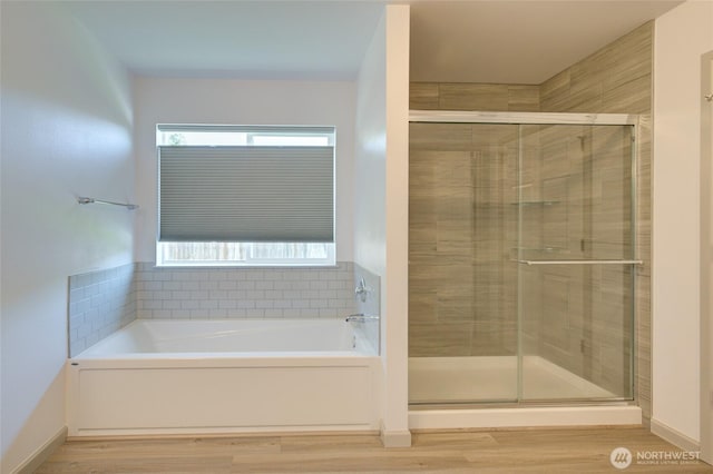 232 Jett Ct, Montesano, WA 98563 - full bath with a garden tub, a shower stall, and wood finished floors