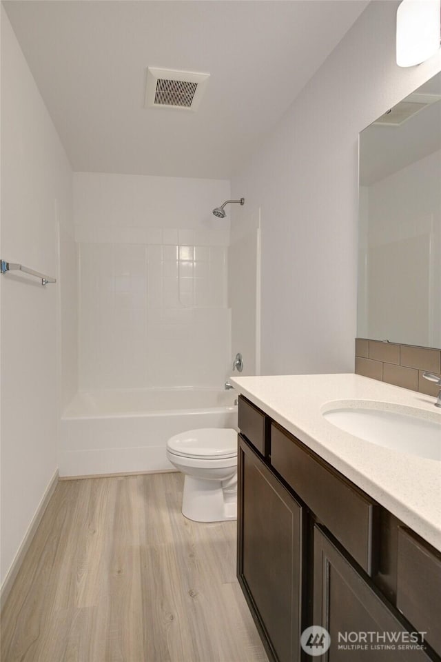 232 Jett Ct, Montesano, WA 98563 - bathroom featuring wood finished floors, vanity, and washtub / shower combination