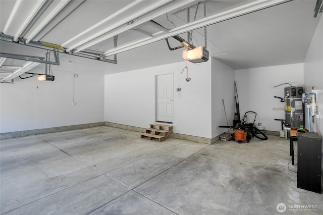 232 Jett Ct, Montesano, WA 98563 - garage with a garage door opener and hybrid water heater