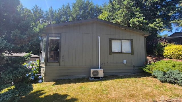 869 Mahogany Ln NW, Silverdale, WA 98383 - view of side of home featuring a cooling unit and a yard