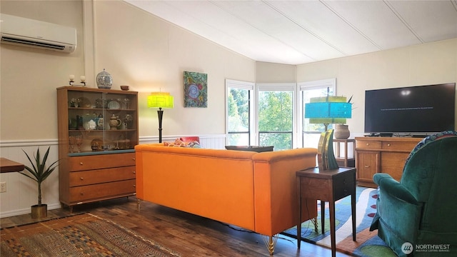 869 Mahogany Ln NW, Silverdale, WA 98383 - living area with a wall mounted air conditioner, dark wood-style floors, lofted ceiling, and wainscoting