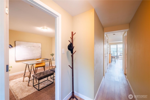 1525 Taylor Ave N Unit 505, Seattle, WA 98109 - hallway featuring baseboards and wood finished floors