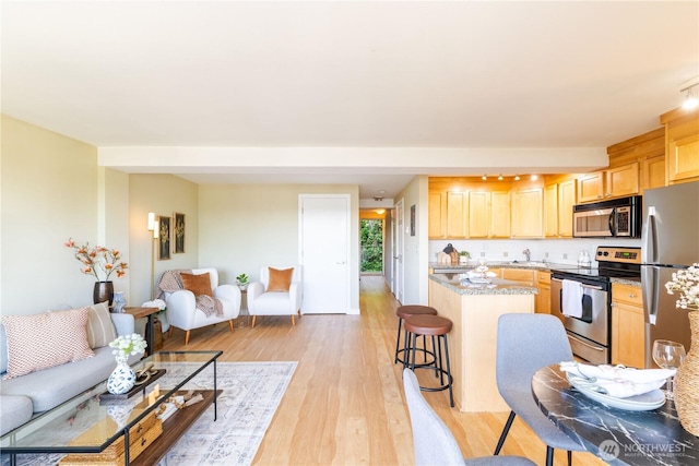 1525 Taylor Ave N Unit 505, Seattle, WA 98109 - living room with light wood-type flooring