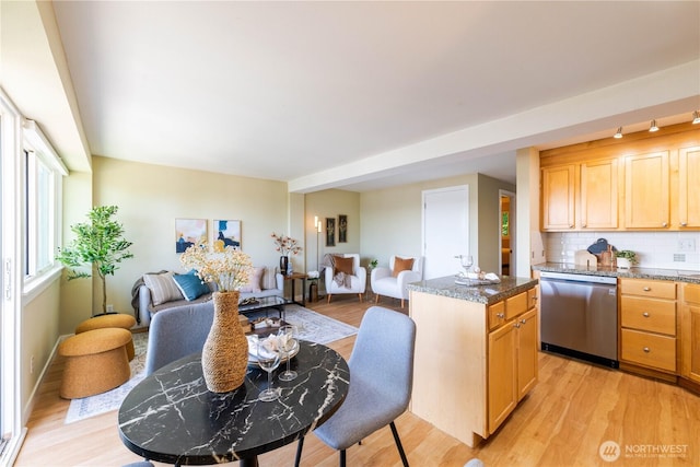 1525 Taylor Ave N Unit 505, Seattle, WA 98109 - kitchen featuring dishwasher, light wood-type flooring, open floor plan, and decorative backsplash