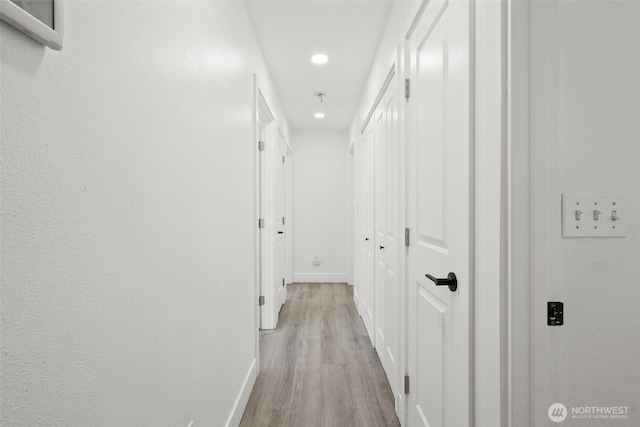 14115 Mountain Vista Dr SE, Yelm, WA 98597 - hallway with recessed lighting and wood finished floors
