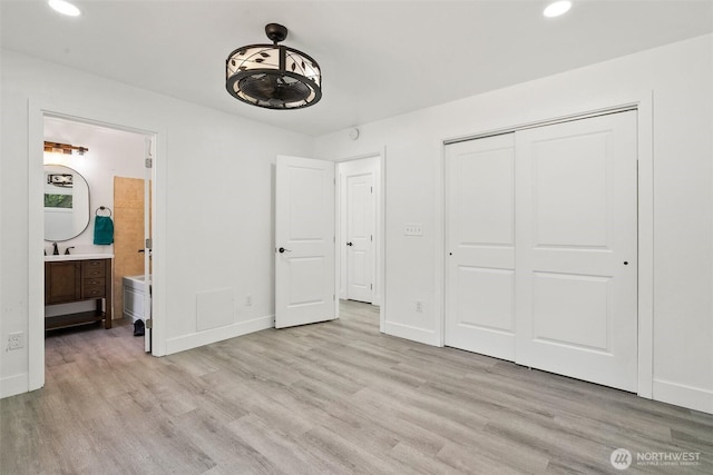 14115 Mountain Vista Dr SE, Yelm, WA 98597 - unfurnished bedroom with light wood-type flooring, a closet, ensuite bath, and recessed lighting