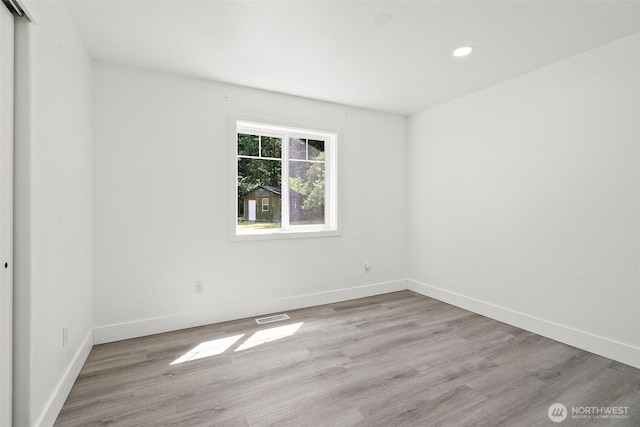 14115 Mountain Vista Dr SE, Yelm, WA 98597 - spare room with wood finished floors and recessed lighting
