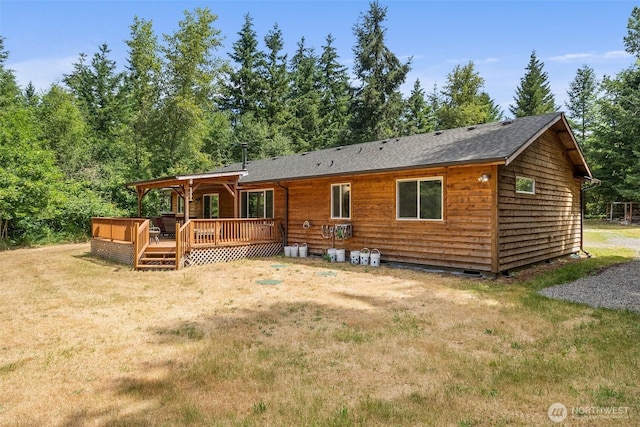 14115 Mountain Vista Dr SE, Yelm, WA 98597 - rear view of property with a yard, a deck, and a shingled roof