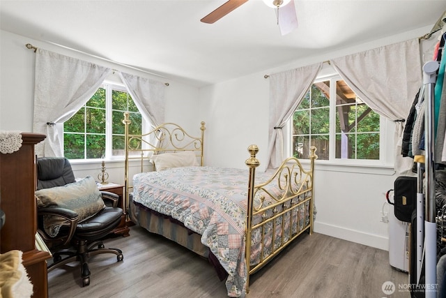 14115 Mountain Vista Dr SE, Yelm, WA 98597 - bedroom featuring wood finished floors and a ceiling fan