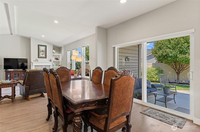 2219 Treat St SE, East Wenatchee, WA 98802 - dining room with light wood finished floors, recessed lighting, and a tiled fireplace