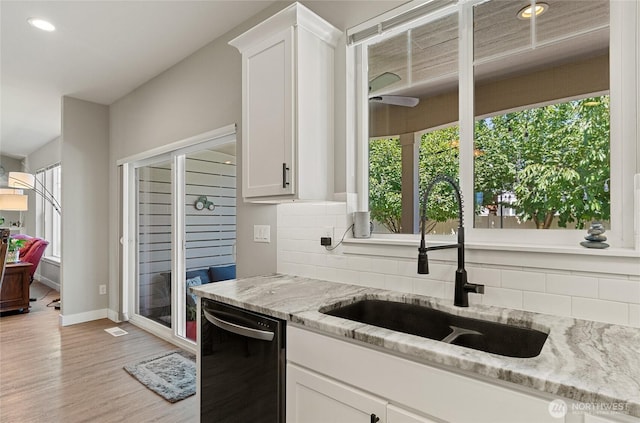 2219 Treat St SE, East Wenatchee, WA 98802 - kitchen featuring dishwashing machine, decorative backsplash, light stone countertops, white cabinetry, and recessed lighting