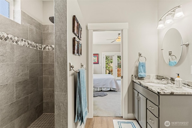 2219 Treat St SE, East Wenatchee, WA 98802 - ensuite bathroom with vanity, ceiling fan, tiled shower, and wood finished floors