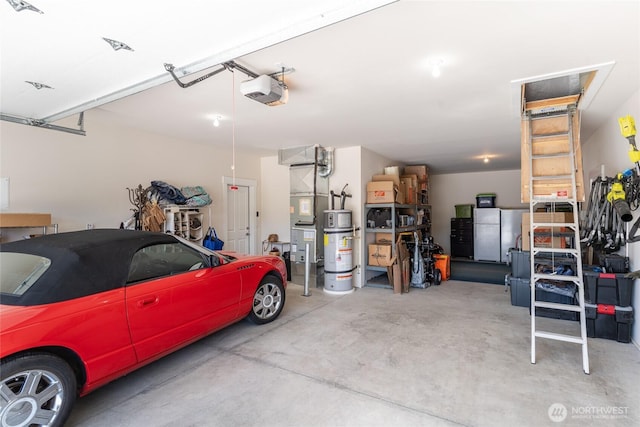 2219 Treat St SE, East Wenatchee, WA 98802 - garage with a garage door opener and freestanding refrigerator