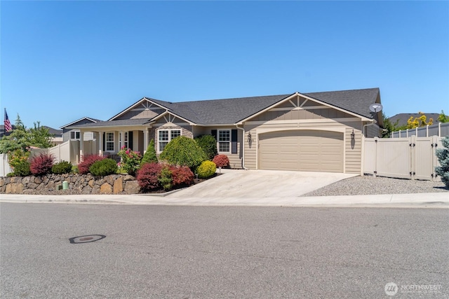 2219 Treat St SE, East Wenatchee, WA 98802 - view of front of property featuring a garage, a gate, and driveway