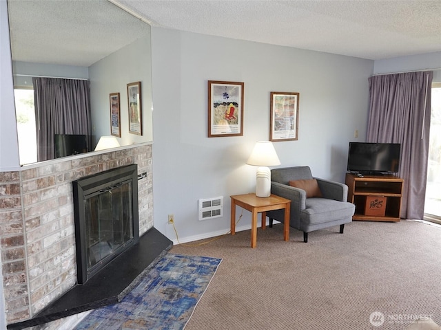615 Ocean Shores Blvd NW Unit 115, Ocean Shores, WA 98569 - carpeted living room with healthy amount of natural light, a brick fireplace, a textured ceiling, and heating unit