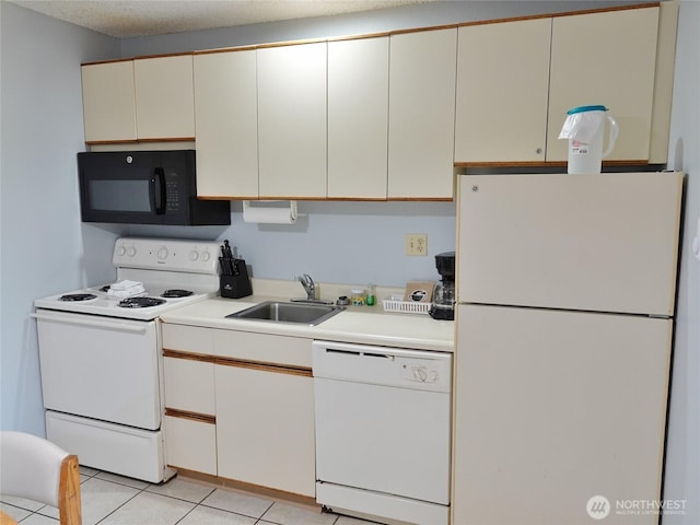 615 Ocean Shores Blvd NW Unit 115, Ocean Shores, WA 98569 - kitchen with white appliances, light countertops, and light tile patterned flooring