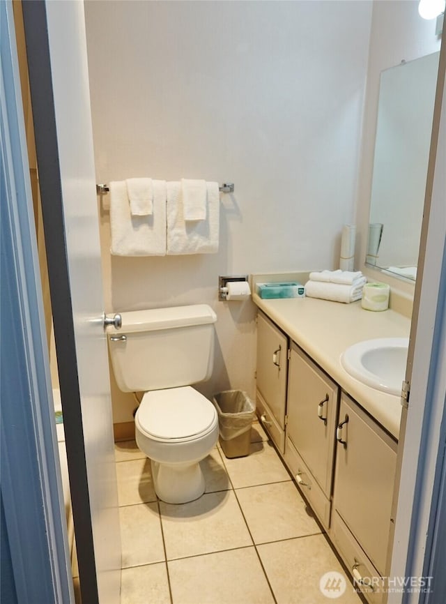 615 Ocean Shores Blvd NW Unit 115, Ocean Shores, WA 98569 - half bathroom with vanity and tile patterned flooring