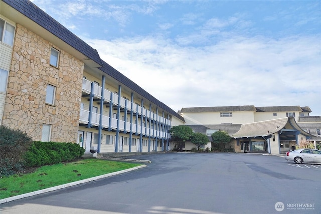 615 Ocean Shores Blvd NW Unit 115, Ocean Shores, WA 98569 - view of property featuring uncovered parking