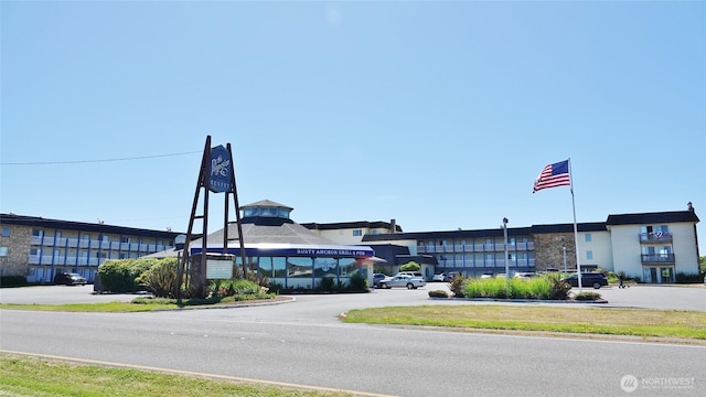 615 Ocean Shores Blvd NW Unit 115, Ocean Shores, WA 98569 - view of property featuring uncovered parking