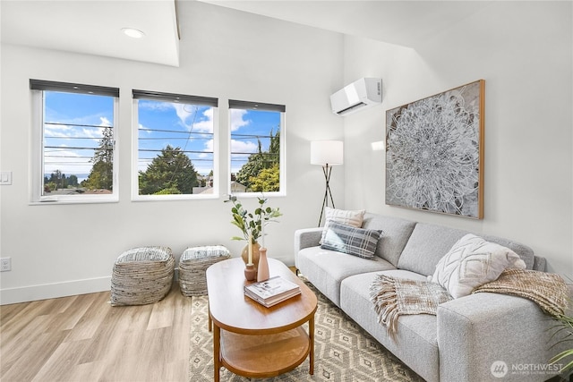 5945 41st Ave SW Unit A, Seattle, WA 98136 - living room featuring a wall mounted air conditioner, plenty of natural light, and wood finished floors