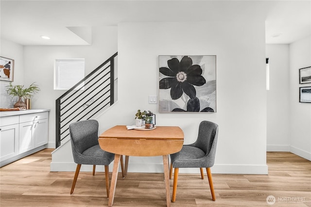 5945 41st Ave SW Unit A, Seattle, WA 98136 - dining area with light wood finished floors, recessed lighting, and stairs
