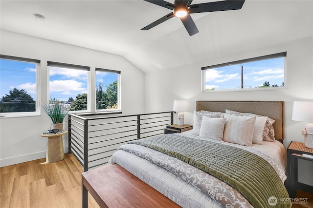 5945 41st Ave SW Unit A, Seattle, WA 98136 - bedroom with vaulted ceiling, light wood finished floors, and a ceiling fan