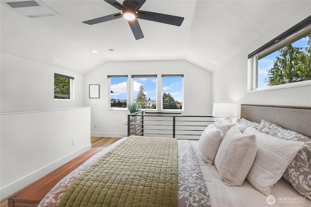 5945 41st Ave SW Unit A, Seattle, WA 98136 - bedroom with multiple windows, wood finished floors, lofted ceiling, and a ceiling fan