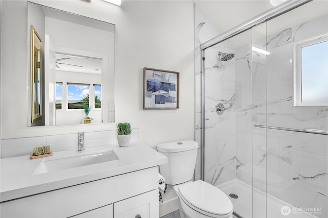 5945 41st Ave SW Unit A, Seattle, WA 98136 - bathroom with a marble finish shower, vanity, and plenty of natural light