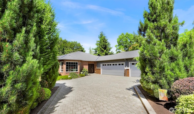 2620 Birch St, Bellingham, WA 98226 - view of front of house featuring brick siding, a garage, and decorative driveway
